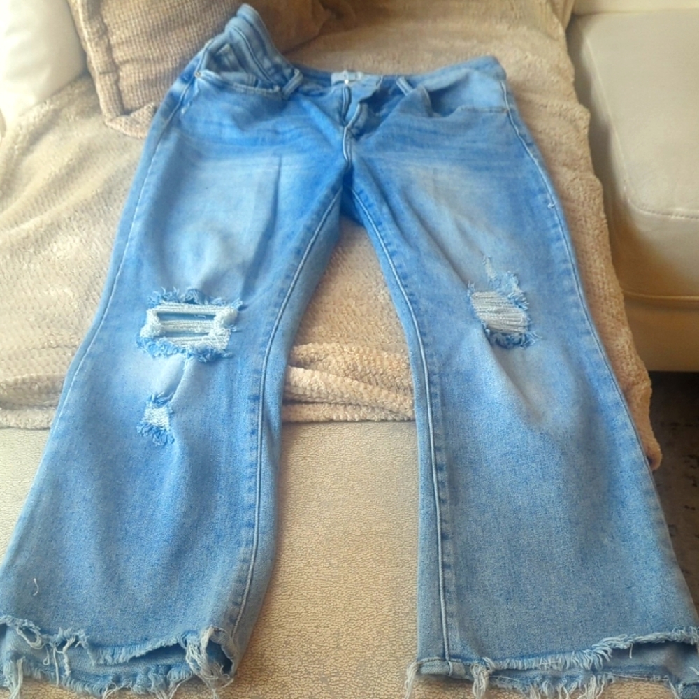 Classic Blue Flare Jeans with Distressed Hem